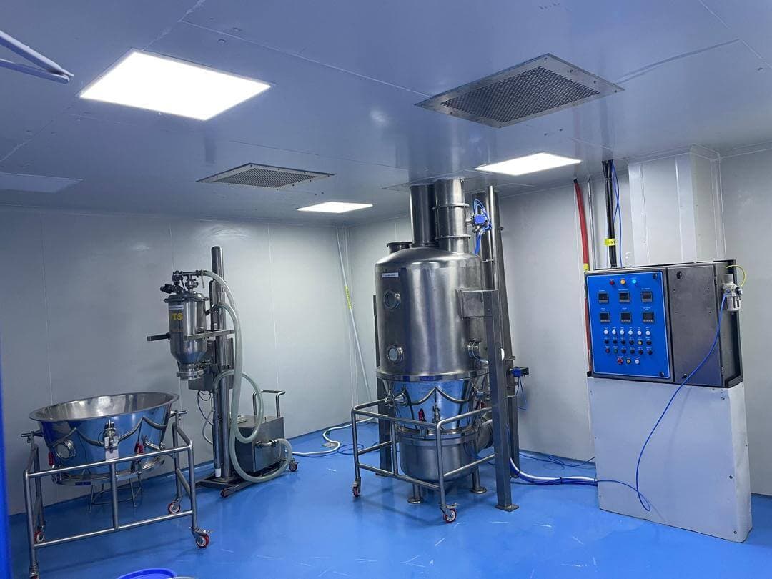 Fluid bed processing equipment with control panel in the facility