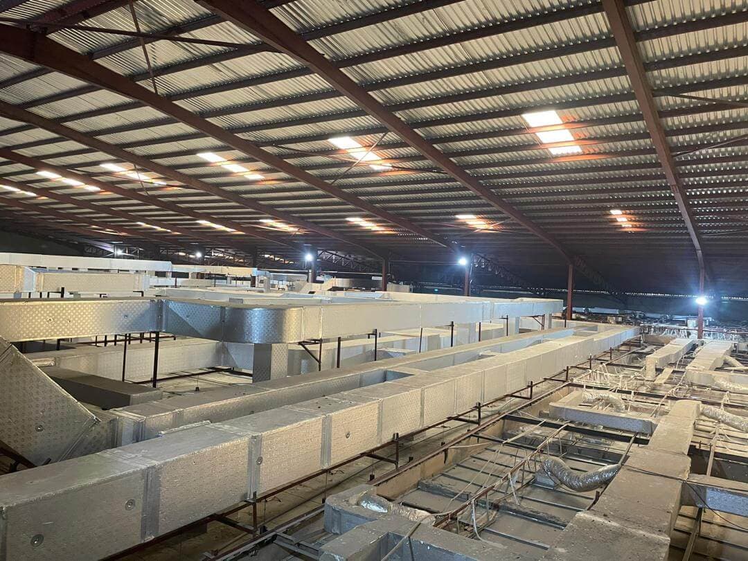 HVAC ductwork and air handling infrastructure above the production floor