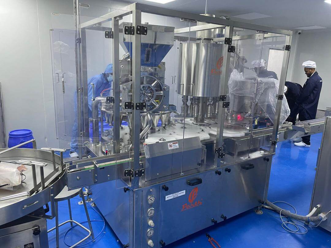 Bottle filling and capping line operated by production staff